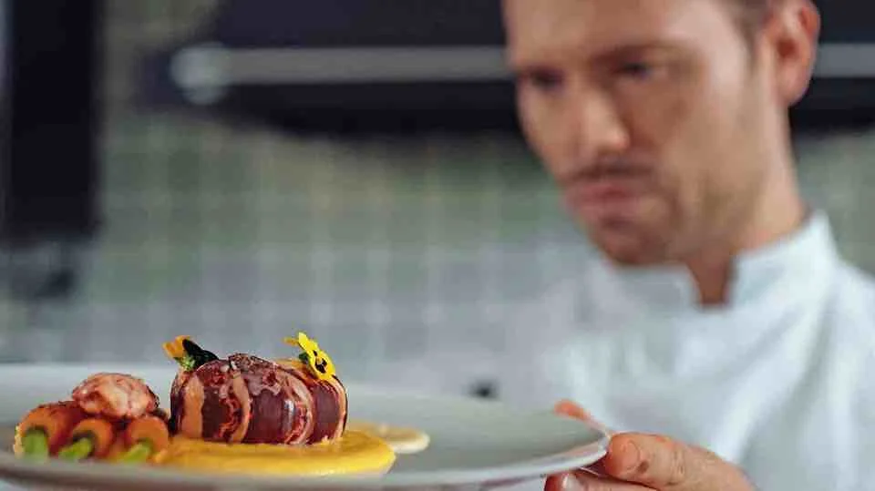 Chef plating a dish: Adam Brunet