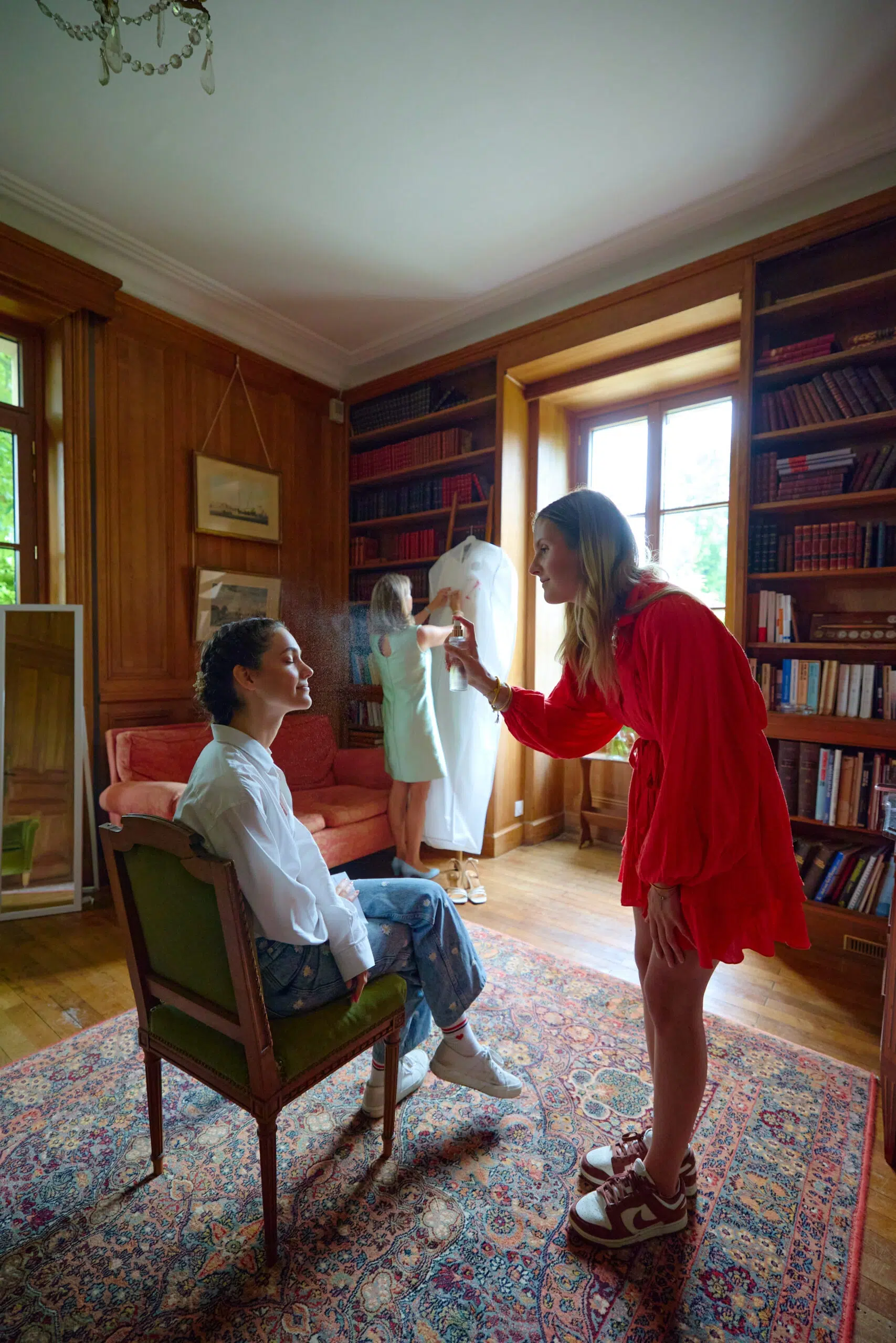 The groom adjusting his bow tie
