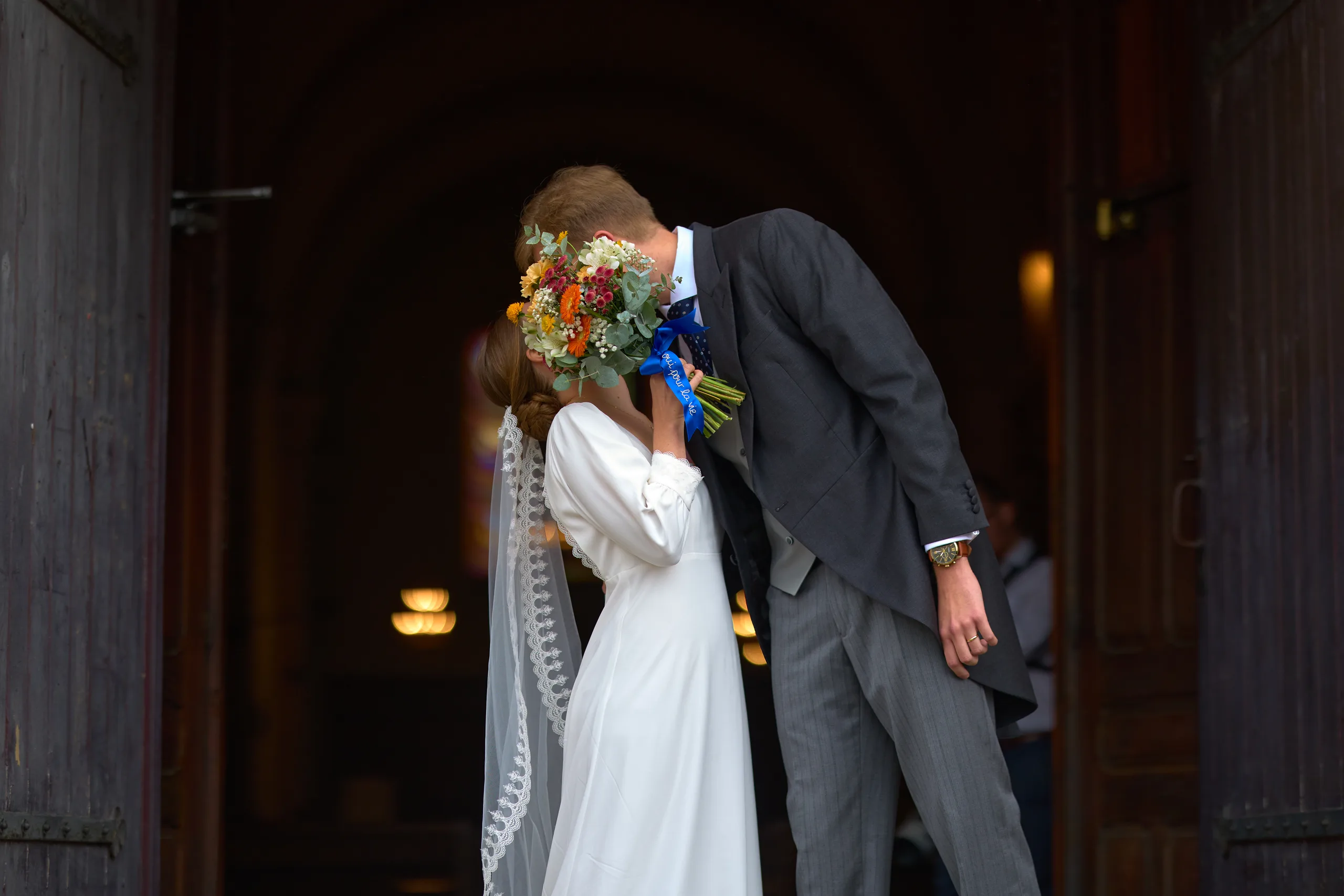Jade and Luc leaving their wedding ceremony