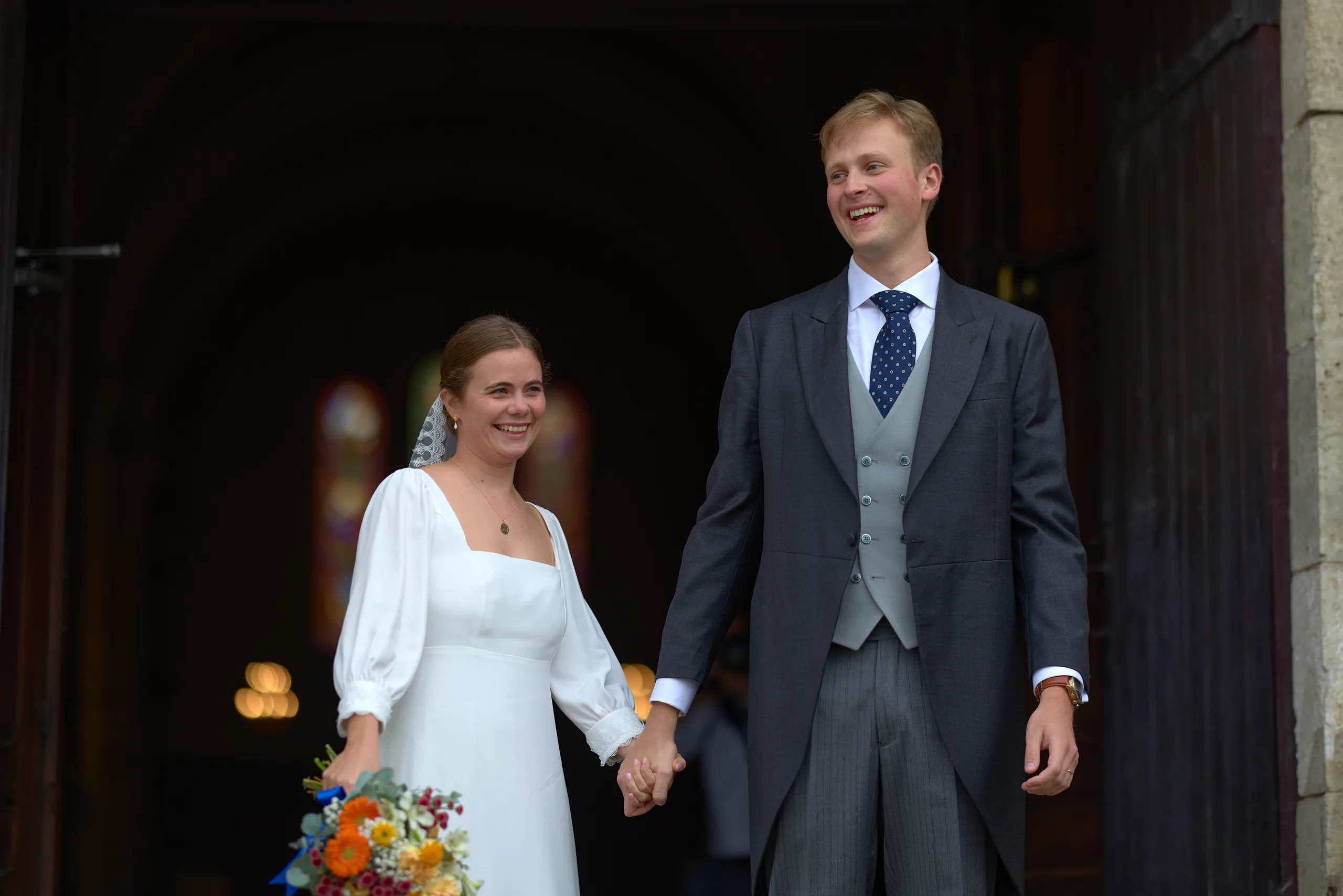 Jade and Luc leaving their wedding ceremony