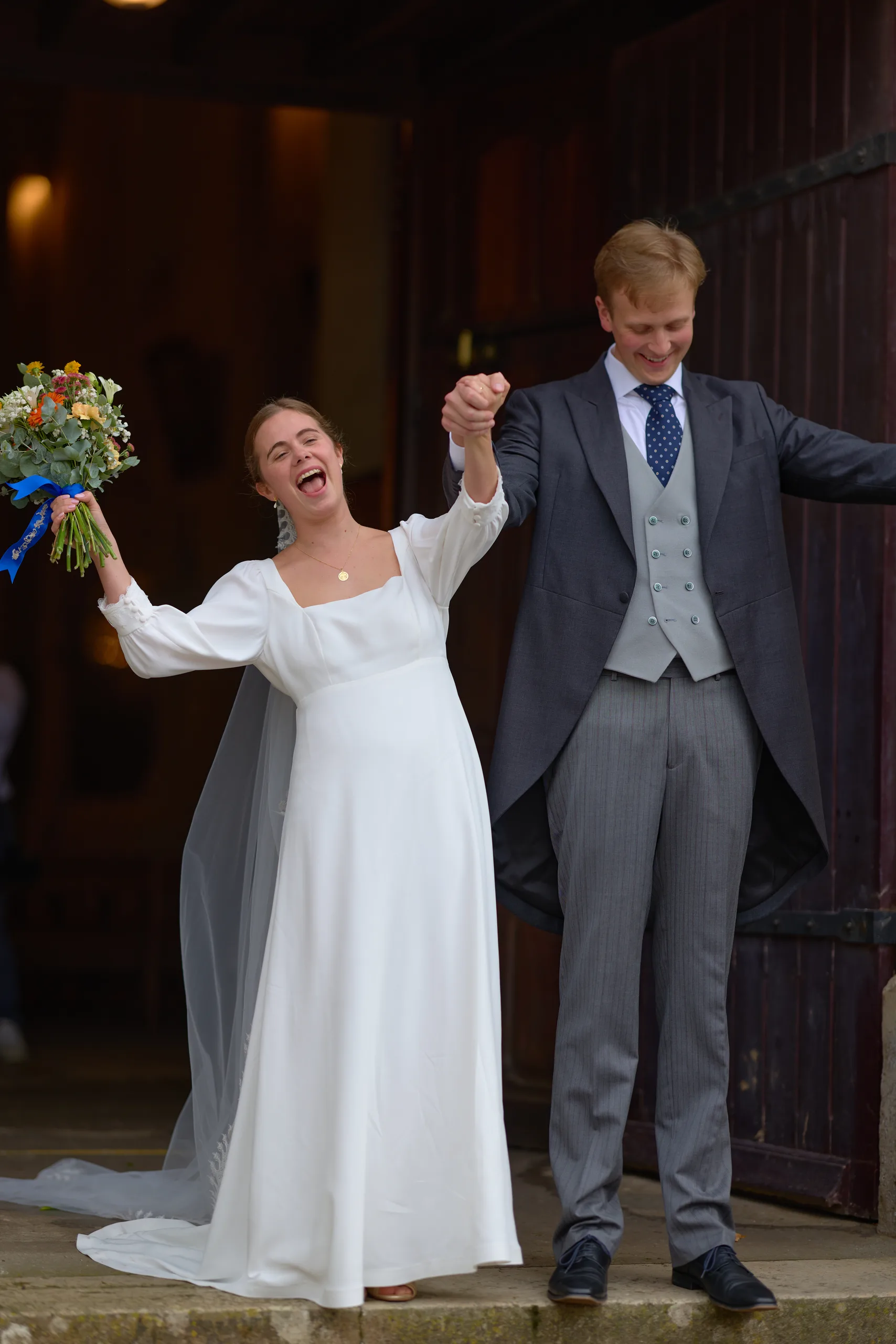 Jade and Luc leaving their wedding ceremony