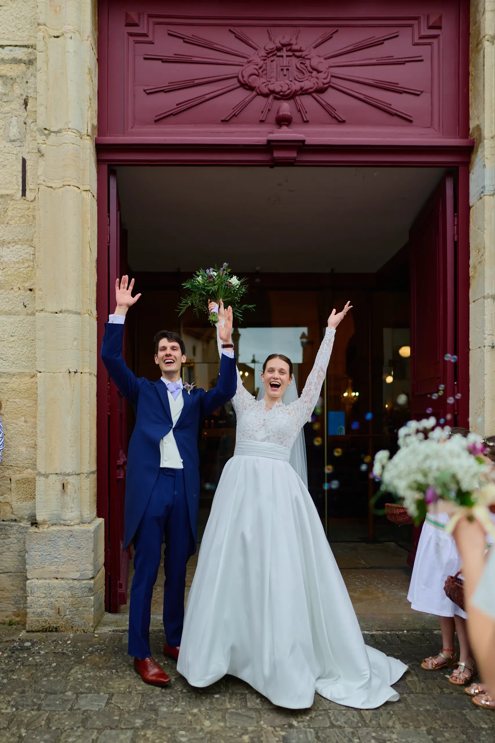 The newlyweds posing in front of a historic military aircraft