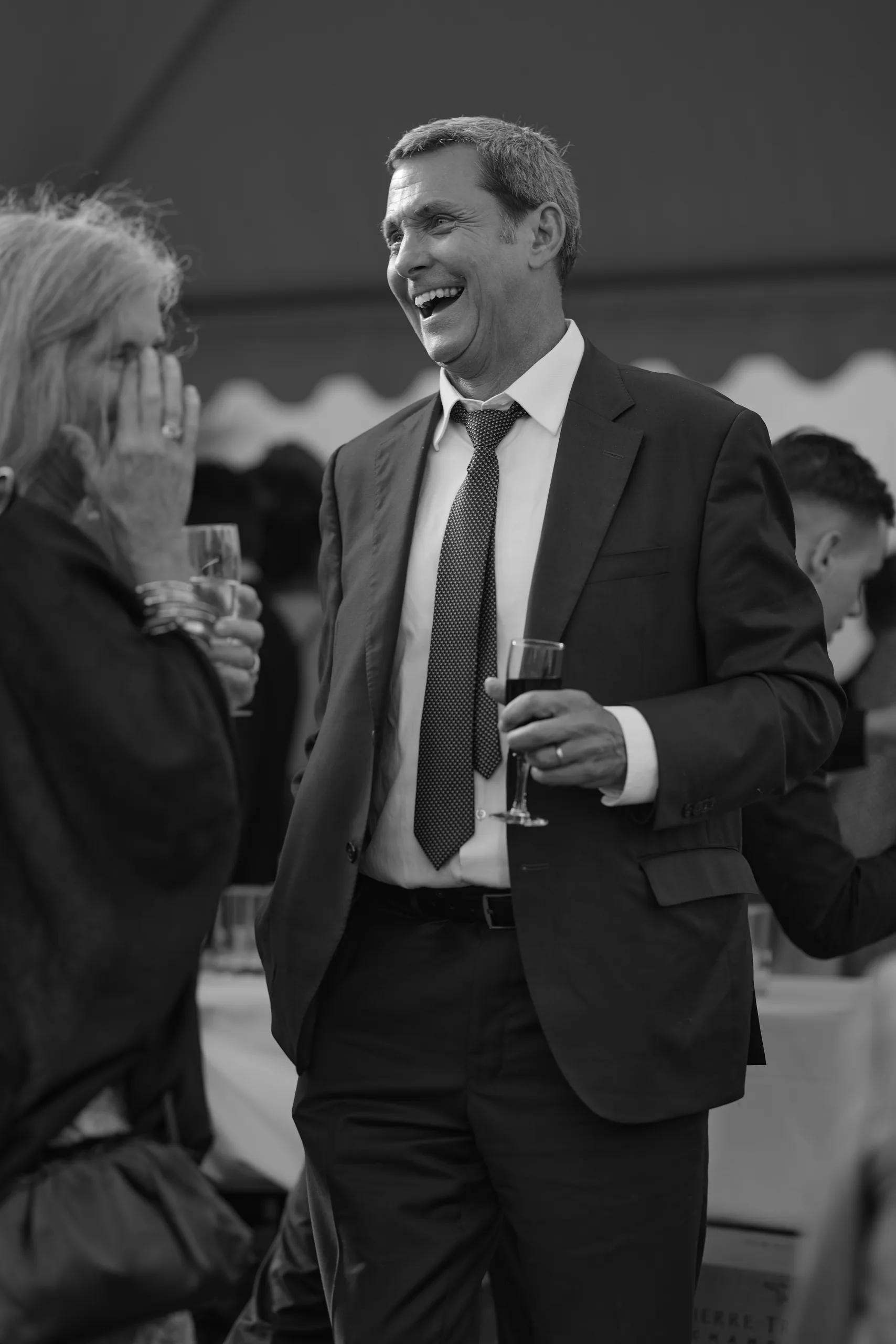 Guests laughing during the meal